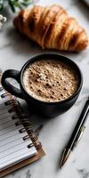 Warm coffee and croissant moment at breakfast table photo