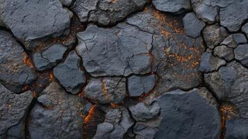 A close up of a lava rock with orange flames photo