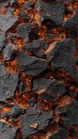 A close up of a black rock with orange flames photo