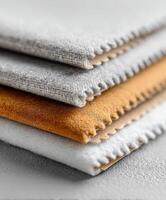 A stack of three different colored cloths photo