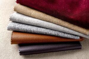 A stack of different colored leathers photo