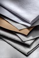 A stack of papers with different colors photo