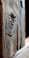 Close up of a wooden plank with a face photo