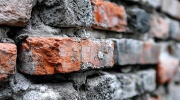 A close up of a brick wall with red and white paint photo