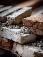 A pile of bricks and mortar on a brick wall photo