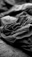A black and white photo of a pile of clothes