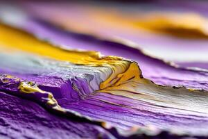 A close up of a purple and yellow paint photo
