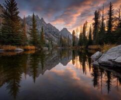 The mountains are reflected in the water at sunset photo