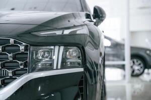 Front close up view of modern black ,car photo