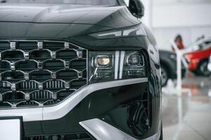 Front ,,close up view of modern black car photo