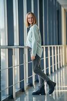 Front view. Young woman in airport ,hall photo