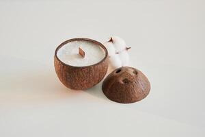 Coconut,, shape. Handmade ,beautiful decorative candles on the background photo