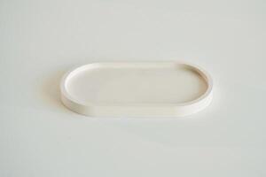 Capacity for candle on the white surface. photo