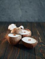 In shape of coconut. Handmade ,,beautiful decorative candles on the background photo
