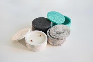 In ,capacities. Handmade ,beautiful decorative candles on the background photo