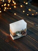 Wooden ,surface. Handmade beautiful decorative candle on the background. photo