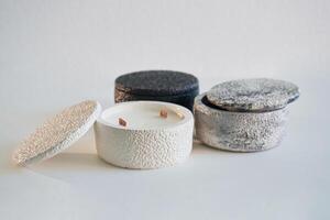 In ,capacities.. Handmade beautiful decorative candles on the background photo