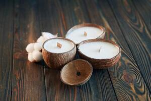 In ,shape of coconut. Handmade beautiful decorative candles on the background photo