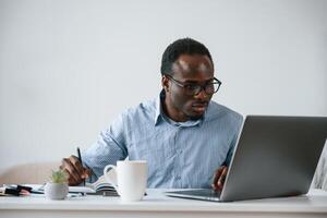 Manager, is,, using ,laptop. Businessman is working in the office photo