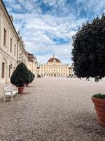 Courtyard with a large building in the background photo