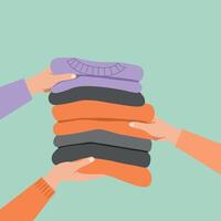 Hands Exchanging Folded Warm Clothes Flat Illustration for Donation or Sharing Concept vector