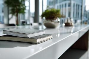 Notebook rests on a bright reflective surface near window light photo