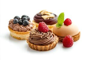 Dessert trio, mousse, biscuit, isolated with white background photo