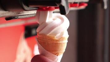 Enjoying creamy ice cream from a cone at a local parlor on a sunny day video