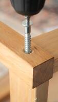 Building furniture with a power drill in a workshop setting video