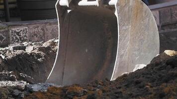 Heavy machinery operates in construction site digging process video