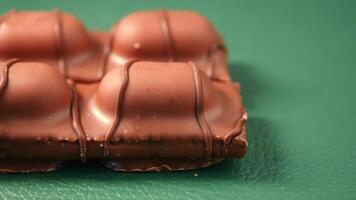 Chocolate treat with smooth texture and glossy finish on display video