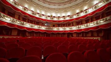 Classical theater inside. Rows of empty red velvet chairs in the opera house. Beautiful dramatic hall with vacant seats. video