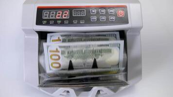 Automatic money counting in the machine. Electronic money machine is counting the dollar banknotes. Front view. Close-up. video