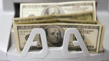 Counting process of dollar banknotes. Automated financial operations. Currency counting machine counts hundred dollar bills. Banking and commercial activity. Close-up. video