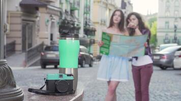 Two women exploring the city with a map in hand video