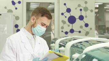 Diligent laboratory assistant meticulously records test results video