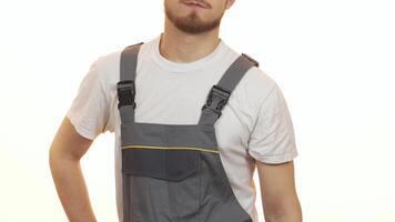 Confident industry worker showcasing a powerful drilling machine video