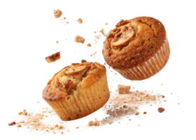 Delicious muffins are flying through air with crumbs scattering around them creating joyful and playful scene png