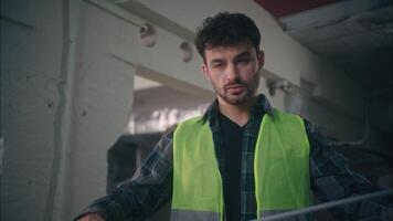 Serious Caucasian male contractor inspector man holding ruler architect using tool measuring tape ruler in construction guy builder working repairman building handyman repairing with measure roulette video