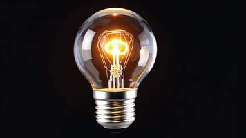 Clear glowing light bulb with visible filament centered on black background, symbolizing innovation, creativity, and bright ideas, ideal for design, energy, technology, and inspiration video