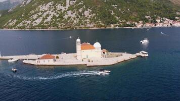 Aerial view of islands of Our Lady of the Rocks church and the tourist town of Perast. Aerial view of the two islands with the town of Perast and the coasts of the Bay of Kotor, Montenegro video