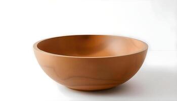 a wooden bowl sitting on top of a white table photo