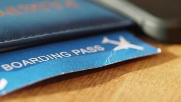 Preparing for a trip with a boarding pass on a wooden table video