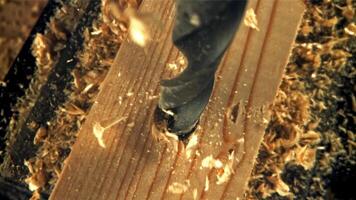 Observe the intricate process of wood drilling, capturing the essence of craftsmanship and precision. video