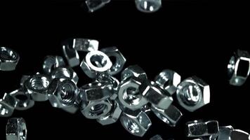 The mounting nuts fly up and fall down. Filmed on a high-speed camera at 1000 fps. High quality FullHD footage video