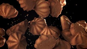 The cookies fly up and fall down. Filmed on a high-speed camera at 1000 fps. High quality FullHD footage video