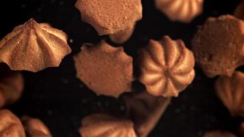 The cookies fly up and fall down. Filmed on a high-speed camera at 1000 fps. High quality FullHD footage video