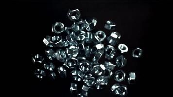 The mounting nuts fly up and fall down. Filmed on a high-speed camera at 1000 fps. High quality FullHD footage video