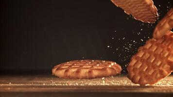 Cookies fall on a wooden table. Filmed on a high-speed camera at 1000 fps. High quality FullHD footage video