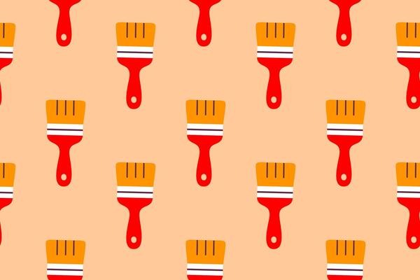 Seamless pattern with red and yellow paintbrushes on orange background